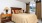 bedroom with nightstands and a large window